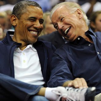 WASHINGTON, DC - JULY 16: U.S. President Barack Obama and Vice President Joe Biden share a laugh as the US Senior Men's National Team and Brazil play during a pre-Olympic exhibition basketball game at the Verizon Center on July 16, 2012 in Washington, DC. (Photo by Patrick Smith/Getty Images)