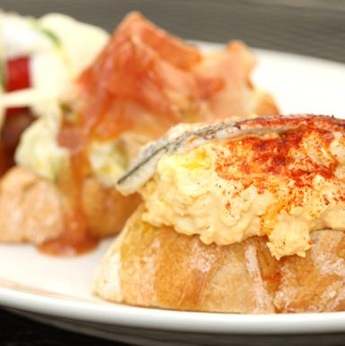 Egg salad with boqueron; creamed leeks, membrillo, Idiazabal, jamon Serrano; tuna-stuffed piquillo, boqueron, ali oli