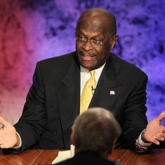 Former CEO of Godfather's Pizza Herman Cain speaks during the Republican Presidential debate hosted by Bloomberg and the Washington Post on October 11, 2011 at Dartmouth College in Hanover, New Hampshire. Eight GOP candidates met for the first debate of the 2012 campaign focusing solely on the economy. (Photo by Justin Sullivan/Getty Images)