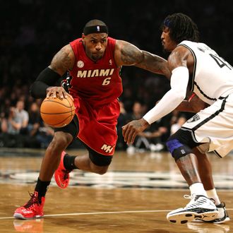 LeBron James #6 of the Miami Heat dribbles against Gerald Wallace #45 of the Brooklyn Nets during their game at the Barclays Center on January 30, 2013 in the Brooklyn borough of New York City.