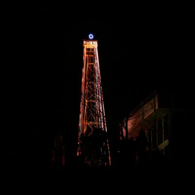 A 30-meter-tall (100-foot-tall) steel Christmas tree with about 30,000 light bulbs, is lit by Christian groups at the western mountain peak, known as Aegibong, in Gimpo, South Korea, Saturday, Dec. 22, 2012. The Christmas tree would be visible by North Koreans living near the Demilitarized Zone that divided the two Koreas. 