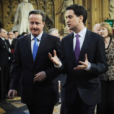 LONDON, ENGLAND - MAY 09: Britain's Prime Minister, David Cameron and opposition Labour Party leader Ed Miliband walk towards the State Opening of Parliament on May 09, 2012 in London, England. Despite opposition from Conservative MPS, the Queen is expected to use her speech to push forward reforms in the House of Lords. Plans to split up banks and change rules on executive pay are also due to be addressed by the government. (Photo by Stefan Rousseau - WPA Pool/Getty Images)