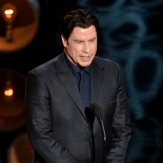 HOLLYWOOD, CA - MARCH 02: Actor John Travolta speaks onstage during the Oscars at the Dolby Theatre on March 2, 2014 in Hollywood, California. (Photo by Kevin Winter/Getty Images)
