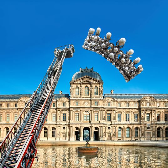 View of the famous Louvre Museum in Paris with reflection