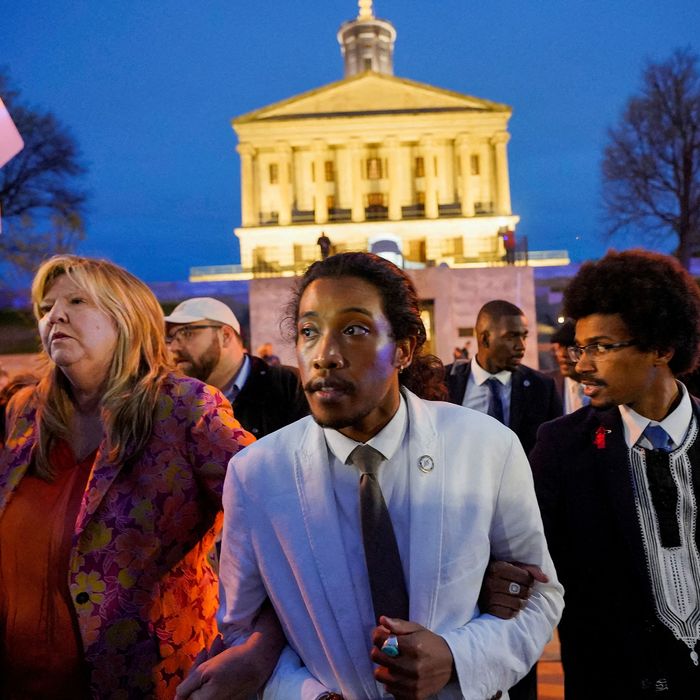 Tennessee Reps. Justin Jones (center) and Justin Pearson (right) at the Tennessee state house, where they were expelled from the House of Representatives on Thursday.
