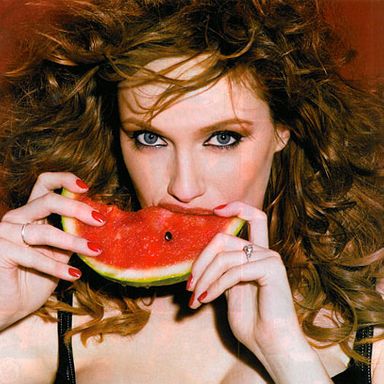 She's not even eating the watermelon, she's sucking on it. If that is supposed to make male Esquire readers cry out in lust, she might have taken off what looks like the engagement ring on her left finger, the one that's communicating she's not really interested in seducing them anyway.