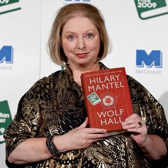 British author Hilary Mantel is pictured with her historical fiction novel 'Wolf Hall' after being awarded the 2009 Man Booker prize at the Guildhall in London on October 6, 2009. AFP PHOTO/Ben Stansall (Photo credit should read BEN STANSALL/AFP/Getty Images)