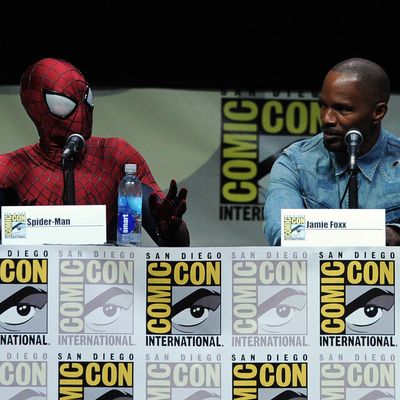 SAN DIEGO, CA - JULY 19: Spider-Man (L) and actor Jamie Foxx speak onstage at the Sony and Screen Gems panel for 