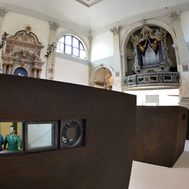 Ai Wei Wei’s SACRED, installed in Venice’s Sant’Antonin, features six iron boxes containing sobering dioramas, viewable through small windows, of the Chinese dissident artist’s 81 days spent in a Chinese prison.