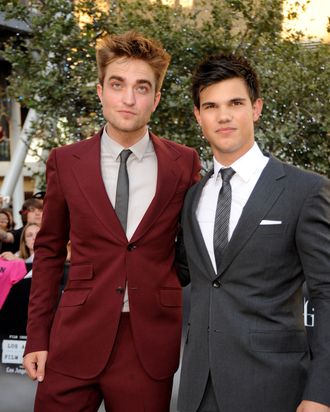 Robert Pattinson & Taylor Lautner. Robert is quite possibly crying inside a little.