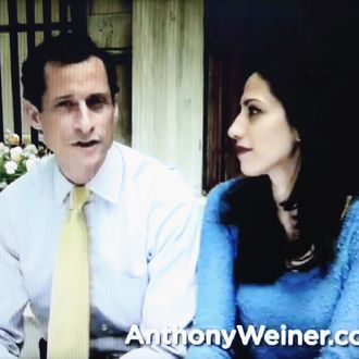 In this photo illustration, former U.S. Rep. Anthony Weiner (L) appears with his wife Huma Abedin in a YouTube video announcing he will enter the New York mayoral race on May 22, 2013 in New York City. Weiner was forced to resign from Congress following the revelation of sexually explicit online behavior. 