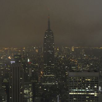 The Empire State Building from the Top of the Rock at Rockefeller Center March 28, 2009 moments after it went dark at 8:30 p.m. as individuals and organizations turn off non-essential lighting for one hour in a call to action for climate change during World Wildlife Fund's Earth Hour 2009.