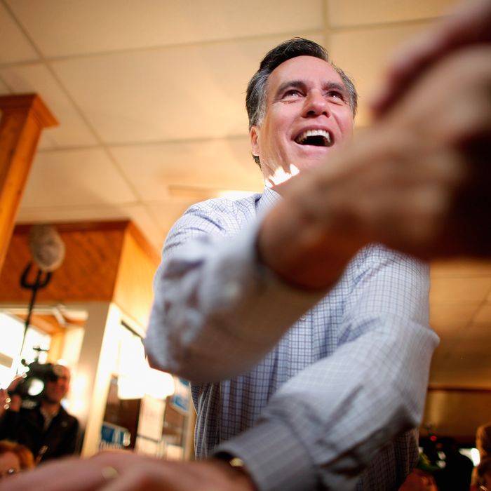 CEDAR FALLS, IA - DECEMBER 29: Former Massachusetts Governor and Republican presidential candidate Mitt Romney greets supporters during a campaign event at J's Homestyle Cooking December 29, 2011 in Cedar Falls, Iowa. Recent state-wide polls put Romney and fellow candidate Rep. Ron Paul (R-TX) close going into next week's first-in-the-country Iowa Caucuses, a litmus test for the GOP hopefuls. (Photo by Chip Somodevilla/Getty Images)