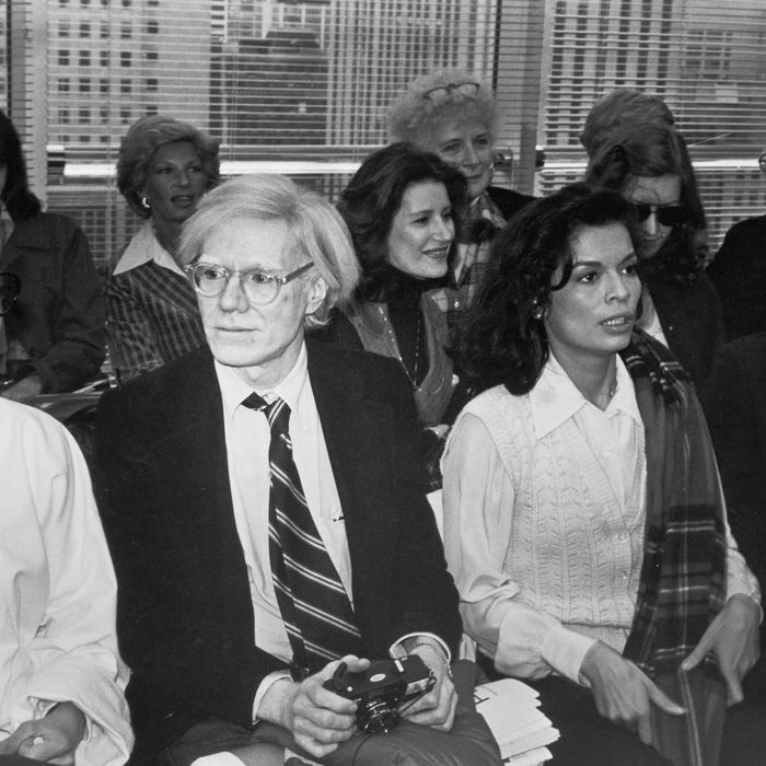 French Vogue editor Françoise de la Renta (nee de Langlade, 1931 - 1983) (left), pop artist Andy Warhol (1928 - 1987) (second left), model Bianca Jagger (second right), and nightclub owner and businessman Steve Rubell (1943 - 1989) attend a fashion show by designer Halston, New York, New York, April 27, 1978. (Photo by Fred W. McDarrah/Getty Images)