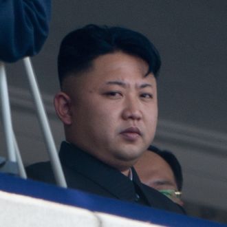 North Korean leader Kim Jong-Un (L) sits with China's Vice President Li Yuanchao (R) during a military parade at Kim Il-Sung square marking the 60th anniversary of the Korean war armistice in Pyongyang on July 27, 2013. North Korea mounted its largest ever military parade on July 27 to mark the 60th anniversary of the armistice that ended fighting in the Korean War, displaying its long-range missiles at a ceremony presided over by leader Kim Jong-Un. AFP PHOTO / Ed Jones (Photo credit should read Ed Jones/AFP/Getty Images)