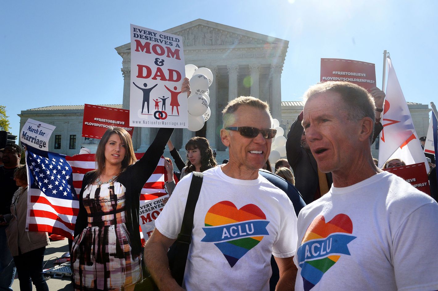 Both Sides of the Same-Sex Marriage Case Duel With Signs and Slogans  Outside the Supreme Court