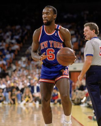 Trent Tucker #6 of the New York Knicks holds the ball during an NBA game against the Los Angeles Lakers in 1989.