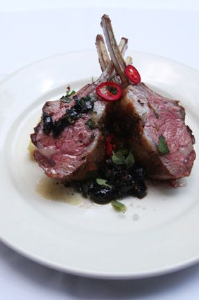 Kosher lamb, quinoa tabbouleh, and black olives.