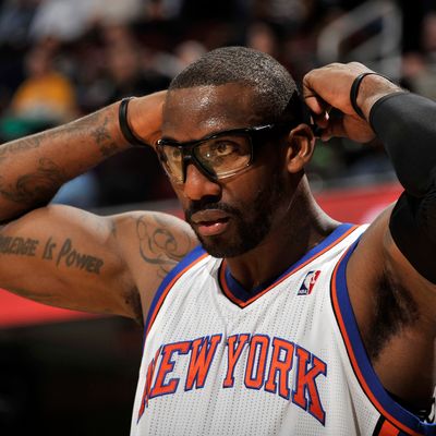 Amare Stoudemire #1 of the New York Knicks adjusts his glasses during a break in the action against the Cleveland Cavaliers at The Quicken Loans Arena on January 25, 2012 in Cleveland, Ohio.