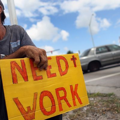 POMPANO BEACH, FL - JUNE 03: Stephen Greene works a street corner hoping to land a job as a laborer or carpenter on June 3, 2011 in Pompano Beach, Florida. Employers in May added 54,000 jobs, the fewest in eight months, and the unemployment rate inched up to 9.1 percent. (Photo by Joe Raedle/Getty Images)
