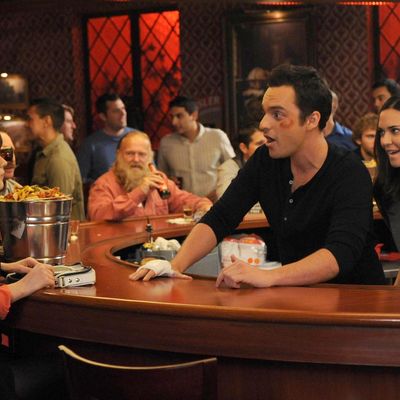 NEW GIRL: Jess (Zooey Deschanel, L) visits Nick (Jake Johnson, C) during his big marketing campaign to promote the bar and meets his beautiful boss (guest star Odette Annable, R) in the 