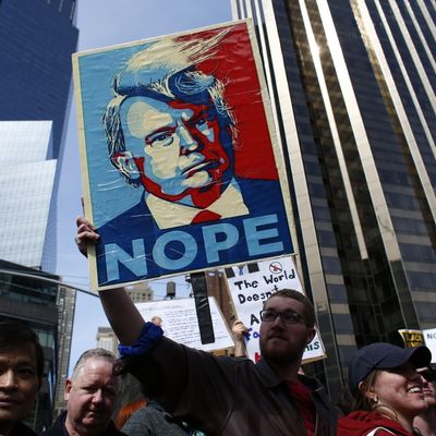 People rally as they take part in a protest against Republican presidential front-runner Donald Trump in New York on March 19,2016.