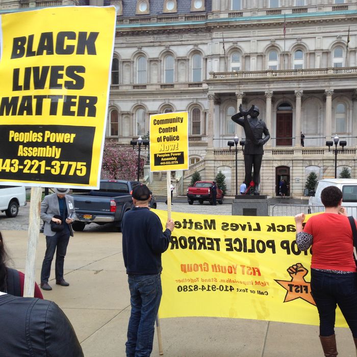Demonstrators protest the death of Freddie Gray outside Baltimore City Hall on Monday, April 20, 2015. Gray died Sunday, a week after he was rushed to the hospital with spinal injuries following an encounter with four Baltimore police officers. (AP Photo/David Dishneau)