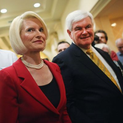 NAPLES, FL - NOVEMBER 25: Republican presidential hopeful and former Speaker of the House Newt Gingrich (R) and his wife Callista enter a Hilton Hotel on November 25, 2011 in Naples, Florida. Gingrich discussed foreign policy issues and restated his position on illegal immigrants in the United States. Gingrich, who has rose in recent polls following strong debate performances, had been written off earlier this year and is now expected to do well in the Iowa caucuses in early January. (Photo by Spencer Platt/Getty Images)