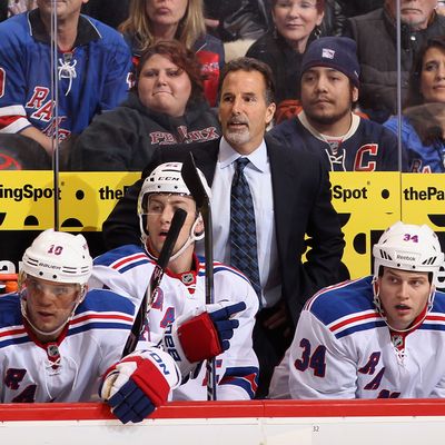 Head coach John Tortorella of the New York Rangers watches from the bench during the NHL game against the Phoenix Coyotes.