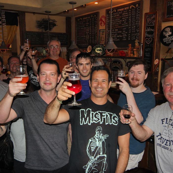 Calagione (in the Misfits shirt) with some friends at the Blind Tiger.