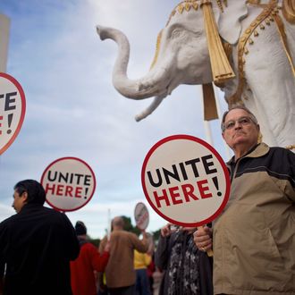 Union members from UNITE HERE Local 54 rally outside the Trump Taj Mahal Casino in Atlantic City, New Jersey