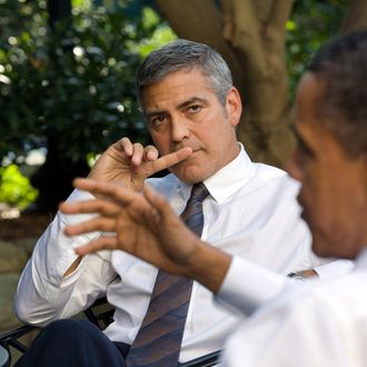  U.S. President Barack Obama (R) talks about Sudan with actor George Clooney during a meeting outside the Oval Office October 12, 2010 in Washington, DC. 