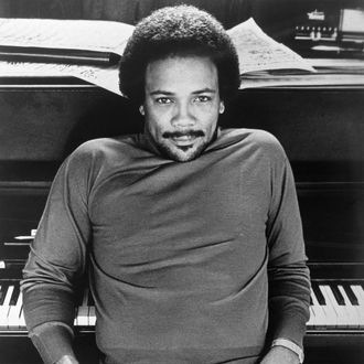 Quincy Jones Leaning Back on Piano