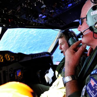 AT SEA - APRIL 11: Royal New Zealand Air Force (RNZAF) Co Pilot squadron Leader Brett McKenzie (L) and Flight Engineer Trent Wyatt sit in the cockpit aboard a P3 Orion maratime search aircraft as it flies over the southern Indian Ocean looking for debris from missing Malaysian Airlines flight MH370 on April 11, 2014 At Sea. Search and rescue officials in Australia are confident they know the approximate position of the black box recorders from missing Malaysia Airlines Flight MH370, Australian Prime Minister Tony Abbott said on Friday. At the same time, however, the head of the agency coordinating the search said that the latest 