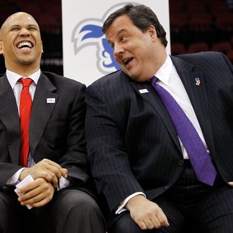In this Jan. 25, 2011 file photo, Newark Mayor Cory Booker, left, jokes with New Jersey Governor Chris Christie during a news conference at the Prudential Center in Newark, N.J. 