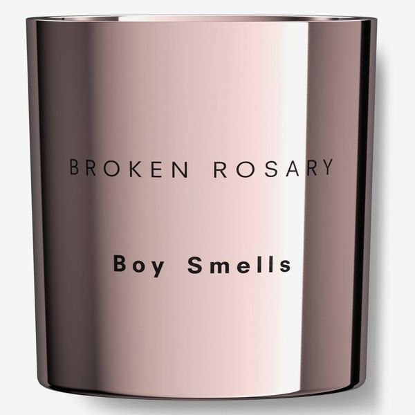 Boy smells broken rose wreath candles