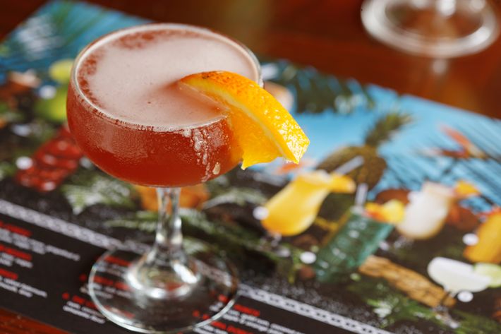 The Singapore Sling is made with gin, cherry Heering, Bénédictine, and pineapple and lime juice.