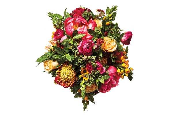 Peony, ranunculus, rose, chinch flower, mint, and pincushion protea
