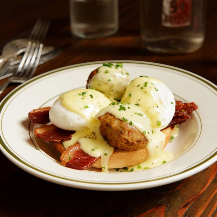 That's the Balls Benedict: two poached eggs, bacon, your choice of meatballs, and hollandaise on a brioche bun.