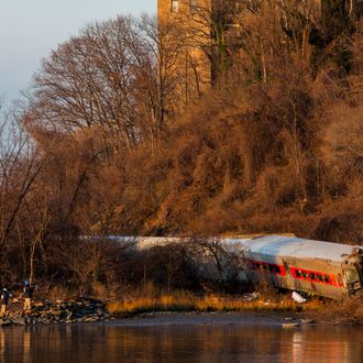 NEW YORK, NY - DECEMBER 1: The wreckage of a Metro-North commuter train lies on its side after it derailed just north of the Spuyten Duyvil station December 1, 2013 in the Bronx borough of New York City. Multiple injuries and at least 4 deaths were reported after the seven car train left the tracks as it was heading to Grand Central Terminal along the Hudson River line. (Photo by Christopher Gregory/Getty Images)