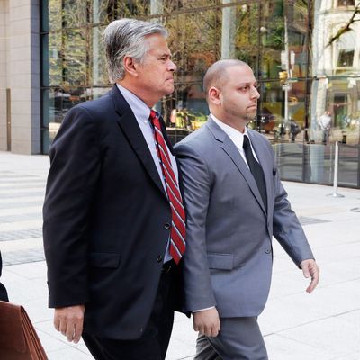 New York Senate Majority Leader Dean Skelos, center, and his son Adam, right. arrive at FBI offices, Monday, May 4, 2015, in New York. The pair surrendered to face charges including extortion and soliciting bribes amid a federal investigation into the awarding of a $12 million contract to a company that hired his son. (AP Photo/Mark Lennihan)