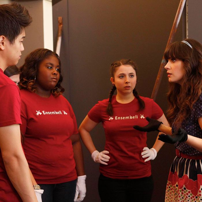 NEW GIRL: Jess (Zooey Deschanel, R) prepares the members of her handbell quartet (L-R: guest stars Ki Hong Lee, Raven Goodwin and Esther Povitsky) to perform in the "Bells" episode of NEW GIRL airing Tuesday, Nov. 29 (9:00-9:30 PM ET/PT) on FOX. ©2011 Fox Broadcasting Co. Cr: Greg Gayne/FOX