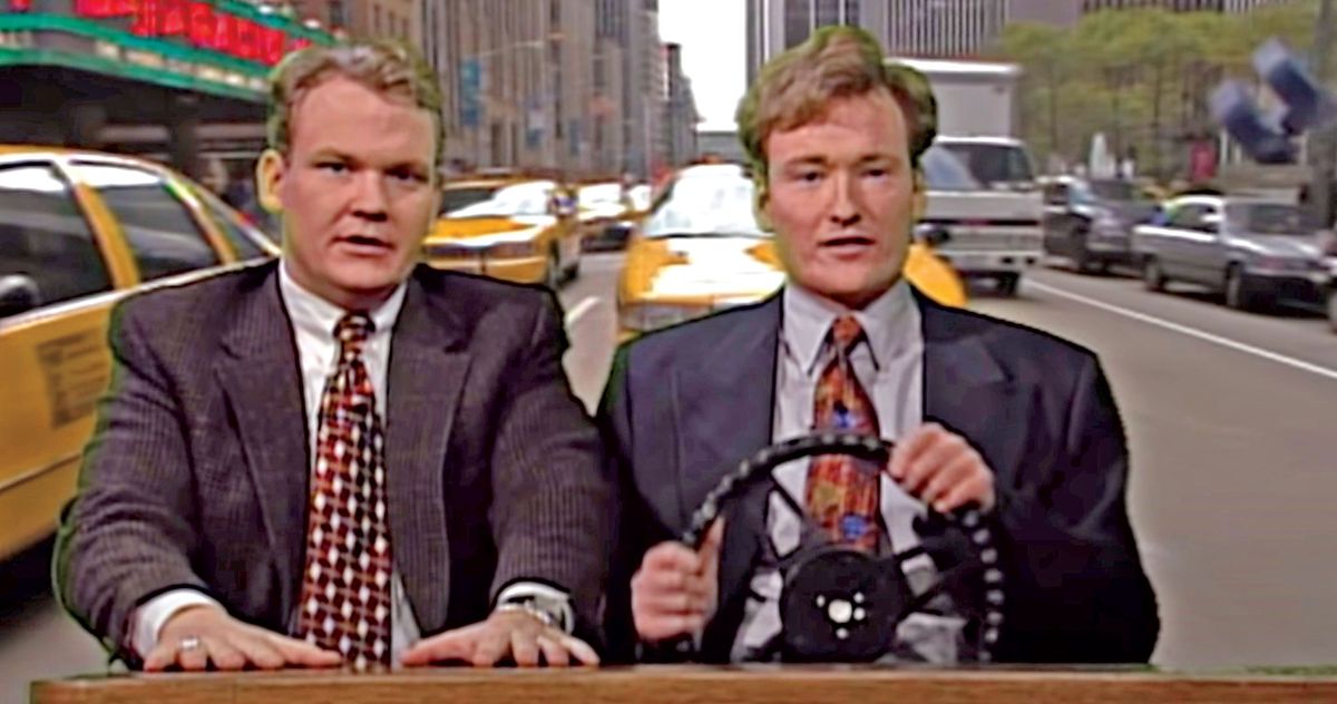 Head writer Mike Sweeney, left, and Conan O'Brien hold their