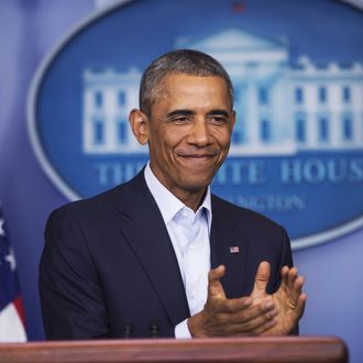 US President Barack Obama applauds retiring ABC reporter Ann Compton as he speaks about the US involvement in Iraq, as well as the situation in Ferguson, Missouri, in the Brady Press Briefing Room of the White House in Washington, DC, August 18, 2014. AFP PHOTO / Saul LOEB (Photo credit should read SAUL LOEB/AFP/Getty Images)