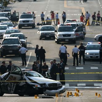 WASHINGTON, DC - OCTOBER 03: Law enforcement personnel gather around a police vehicle that was involved in an incident with another vehicle on Constitution Avenue outside the U.S. Capitol October 3, 2013 in Washington, DC. Capitol police locked down the facility during the incident. (Photo by Mark Wilson/Getty Images)