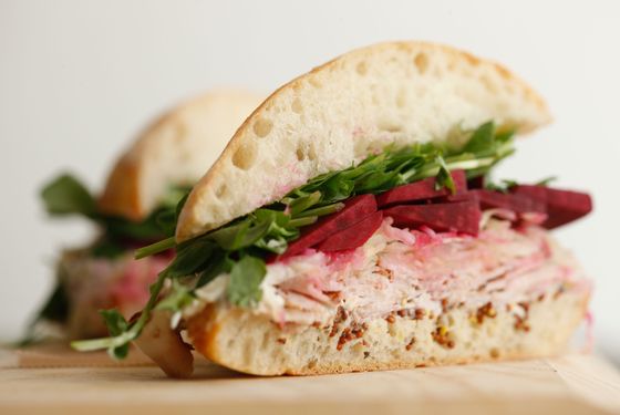 Ciabatta with house-made porchetta, Brussels-sprout kraut, pickled beets, pea shoots, mustard, and horseradish creme fraiche.