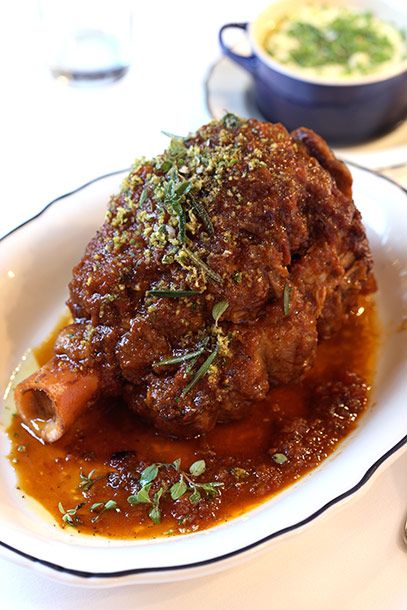 Braised veal shank with soffrito and gremolata.
