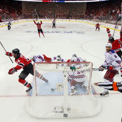 NEWARK, NJ - MAY 25: Adam Henrique #14 of the New Jersey Devils celerbates after scoring the game winning goal in overtime against Henrik Lundqvist #30 of the New York Rangers to win Game Six of the Eastern Conference Final and advance to the 2012 NHL Stanley Cup Final at the Prudential Center on May 25, 2012 in Newark, New Jersey. (Photo by Jim McIsaac/Getty Images)