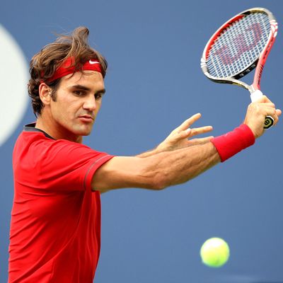Roger Federer of Switzerland hits a backhand against Novak Djokovic of Serbia during Day Thirteen of the 2011 US Open at the USTA Billie Jean King National Tennis Center on September 10, 2011 in the Flushing neighborhood of the Queens borough of New York City. 