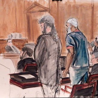 In this courtroom sketch Sulaiman Abu Ghaith, center right, Osama bin Laden's son-in-law, stands next to attorney Stanley Cohen, center, as interpreter Marwan Abdel-Rahman, right, quotes from the Quran on behalf of Abu Ghaith during his sentencing hearing in New York, Tuesday, Sept. 23, 2014. U.S. District Judge Lewis A. Kaplan, left, sentenced Abu Ghaith to life in prison for acting as al-Qaida's spokesman after the Sept. 11, 2001, terror attacks The judge said he saw 